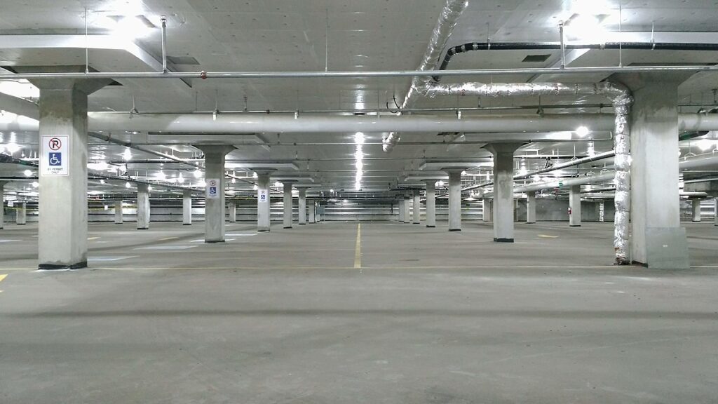 Empty parking garage Parking garage that could be built with enhanced materials, designed to repair its own cracks and ensure long-lasting structural integrity without frequent maintenance.